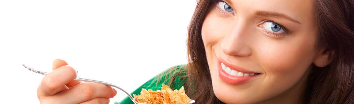 Woman eating a bowl of cereal