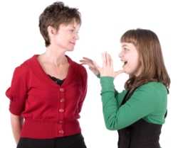 Child signing the word mother to an adult