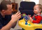 Dad signing with toddler