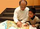 Father and son looking at a map