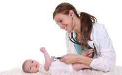 A doctor checking a baby’s heart. 