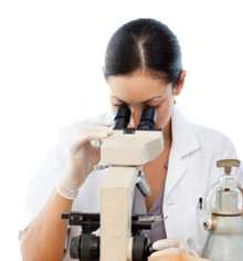 Woman looking through microscope