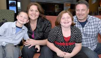 Family sitting and smiling