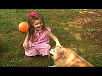 A young girl with her pet dog.