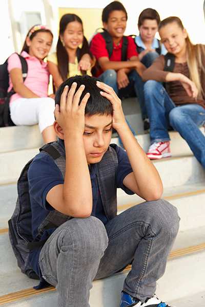 Boy with his hands on his head