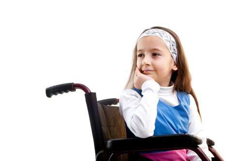 A young girl in a wheelchair