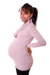 Pregnant woman in a light pink sweater