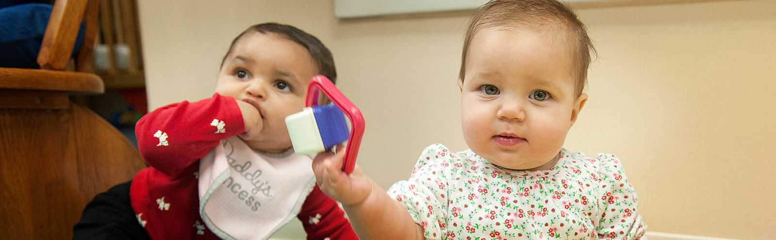 Two babies playing.