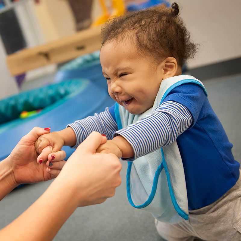 A toddler smiles.