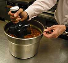 Food cooling ice wand being used to cool a pot of soup