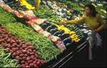 Woman shopping for vegetables.