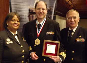 Gelting (center) is shown with US Surgeon General Regina M. Benjamin (left) and Sven E. Rodenbeck (RADM, USPHS) (right). Photo by Sue Gelting.