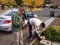 	Bryan Christensen, PhD (EIS 10) (left) and Matthew Lozier, PhD (EIS12) sample for hydrogen sulfide and methane in a community where geothermal venting releases these gases into the air. This was done as part of a Community Assessment for Public Health Emergency Response (CASPER).