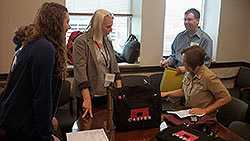 	Ethan Fechter-Leggett, DVM (EIS 13) and Sherry Burrer, DVM (EIS 08) collecting surveys from volunteers during a CASPER in Elk River Chemical spill, West Virginia