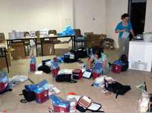 Colleen Martin and Danielle Rentz organize supplies for field Workers.