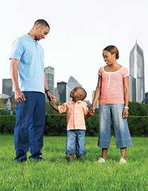 Family standing together in park