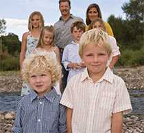 Family with children at a creek