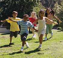 Children running on the grass