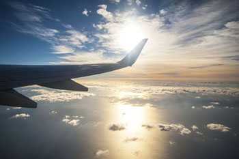 Sunrise over an airplane wing