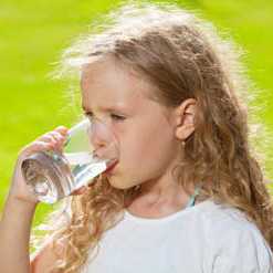 lady holding glass of water