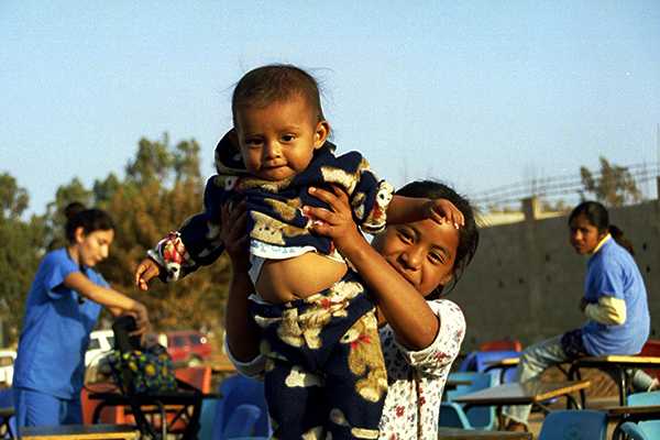 Smiling girl and baby