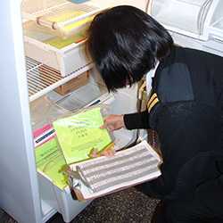 Than Lerner inspects drugs stored at CDCs Seattle Quarantine Station.