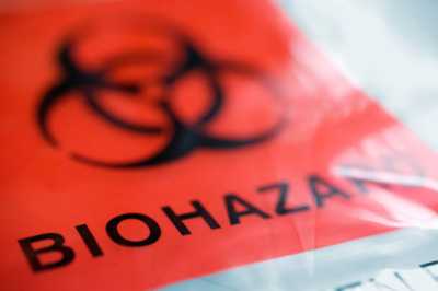 	close-up of biohazard bag with the traditional red label