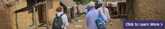 header image for Blog Posts - showing CDC workers walking between buildings in West Africa