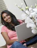 Native American girl with laptop computer