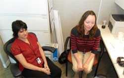 image of staff sitting in cubicle talking