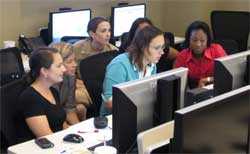 image of staff looking at computer screens.