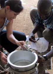 photo of woman and boy boiling water