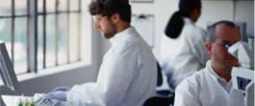 	A laboratory with people working on lab equipment