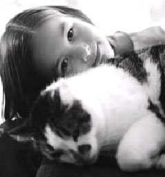 Youth with pet cat.