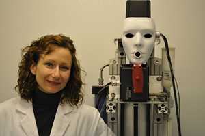 a woman standing next to a 'cough manakin'