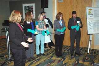 NPPTL Stakeholder Meeting participants in the Pesticide Handler Breakout session try on nitrile gloves to help them understand proper donning and potential self-contamination issues.