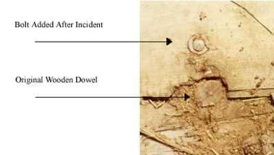 image showing the 
original wooden dowel and the bolt added after the incident