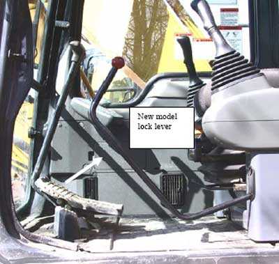 Photo 4. The lock bar in newer model excavators blocks the cab door path when in the unlock position.