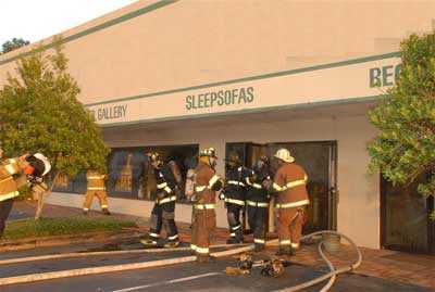 Fire fighters exiting showroom