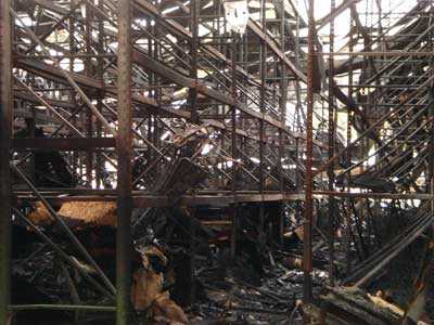 Tall storage racks inside the warehouse after the fire.