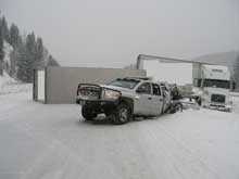 wrecked tractor trailer and pickup truck