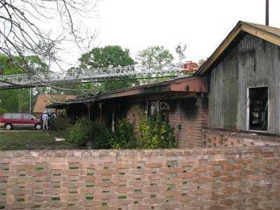 Brick fence wall on the side of structure