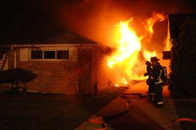 flames shooting out of a vented window