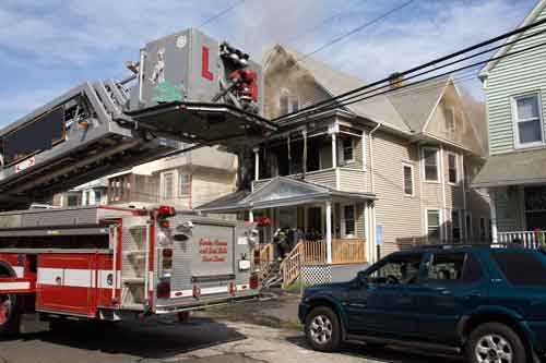 brown smoke from the eaves