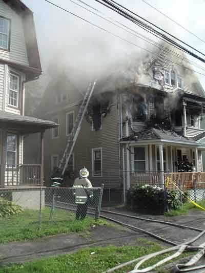 ladder being placed against the house