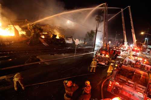 Ladder Hoses  spraying the fire.