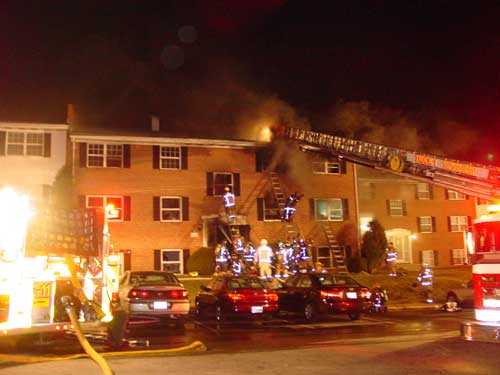 fire fighter dropping from 3rd floor window