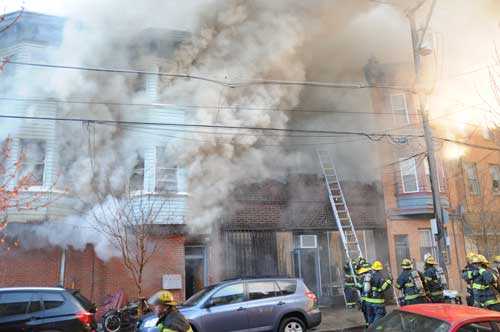 Ladder 27 placing ground ladder to access 2nd floor.