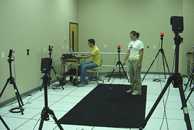 Researchers calibrating the motion analysis system.