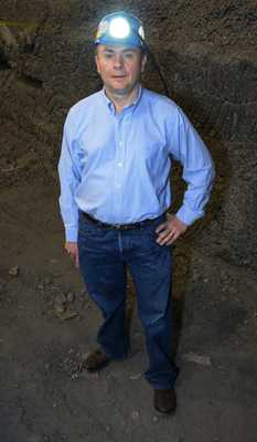 •	OMSHR researcher John Sammarco in the simulated mining environment where he tests the NIOSH LED cap lamp.